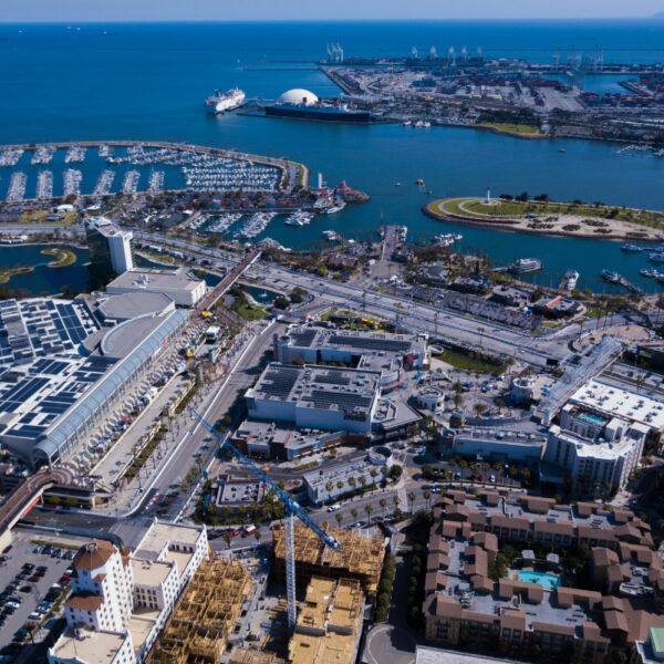 Aerial view of a coastal city with docks and residential areas.