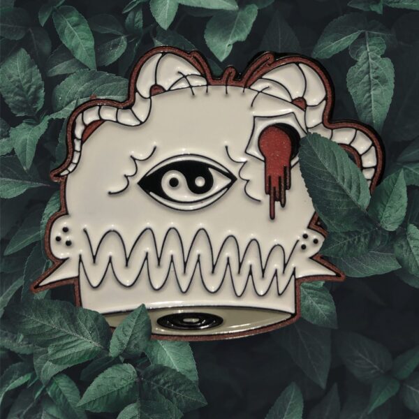 Surreal artwork of an eye and brain with a dripping red element surrounded by green leaves.