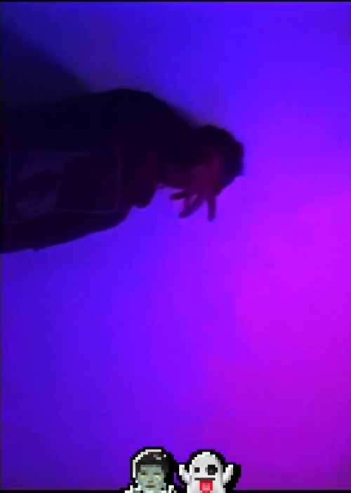 Silhouette of a person against a purple and blue gradient background.