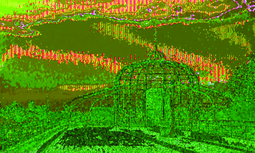 A green-tinted image of a dome-shaped hut with a scenic background.